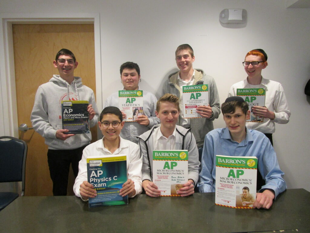 students holding ap course textbooks